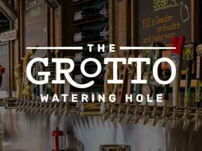 The Grotto watering hole logo