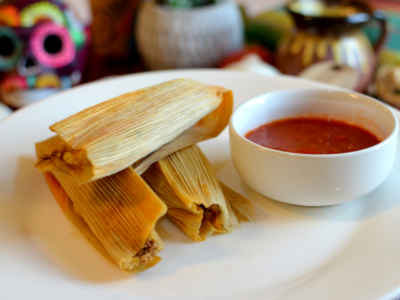 Navarro's Tamales are unique because the "masa" or corn dough is made by slow cooking the corn and stone grinding it in house. The process is true labor of love that you can taste!